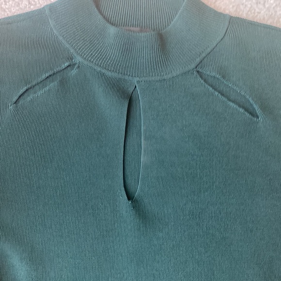 Dark green size small 3 hole cut out on front sleeves are sheer and see through - Picture 4 of 5